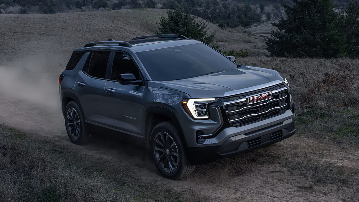 Gray 2027 GMC Terrian driving on off-road trail