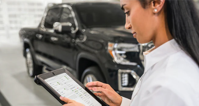 Service bay with person holding tablet
