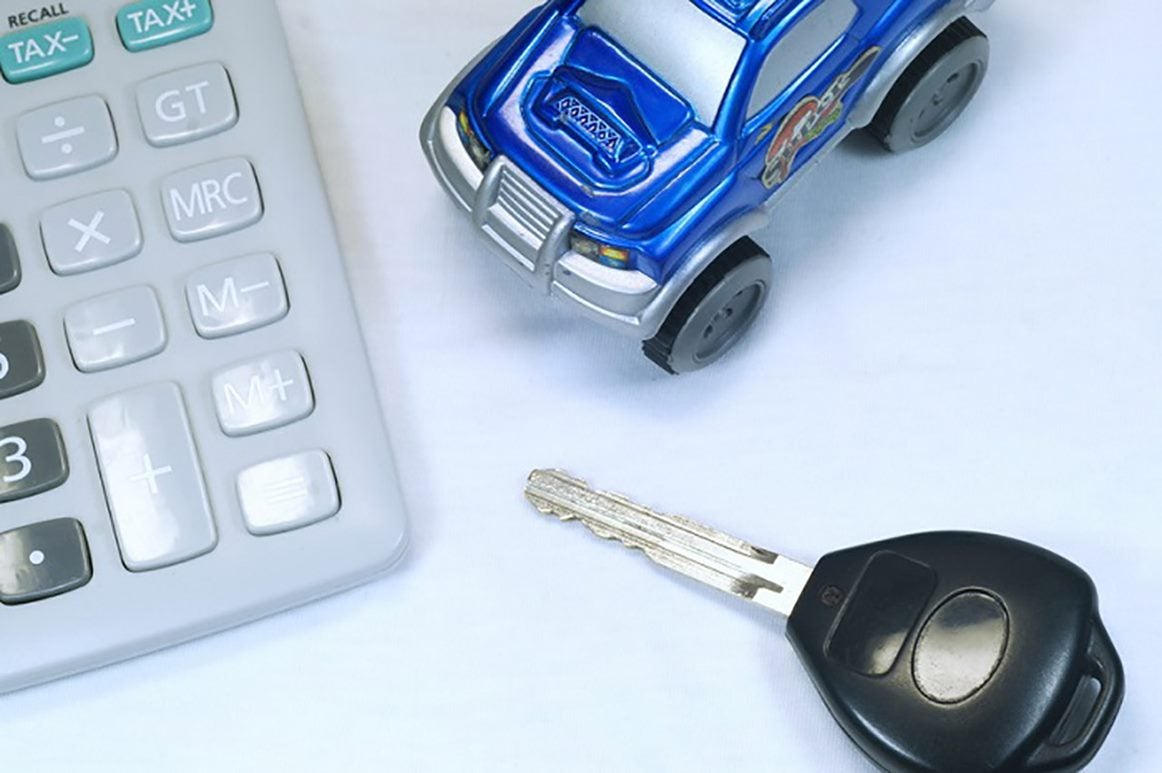 Calculator, toy truck, car key